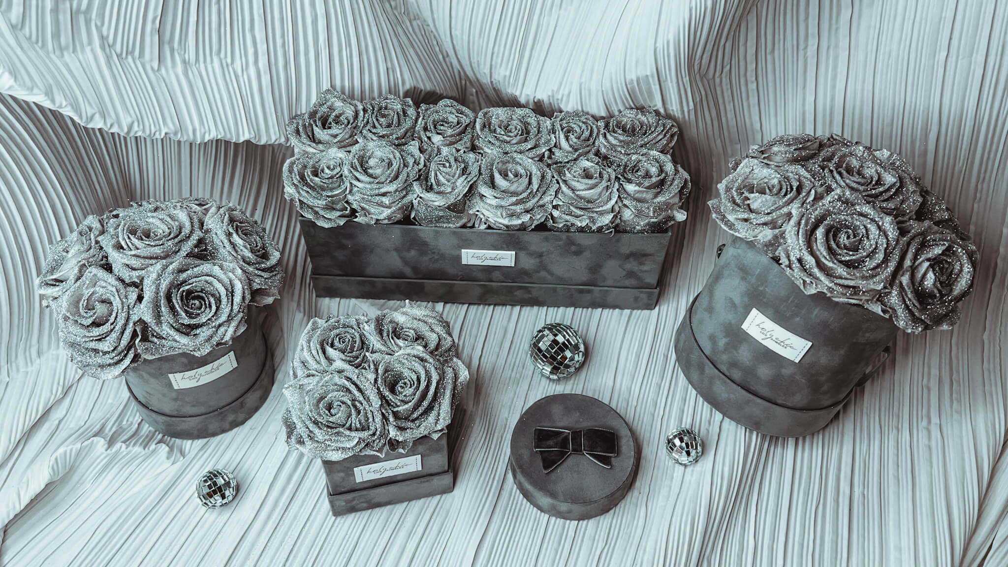 silver forever rose arrangements in the grey velvet boxes