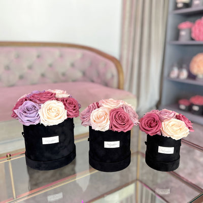 Black vekvet round box with dark pink lavender and powder forever roses