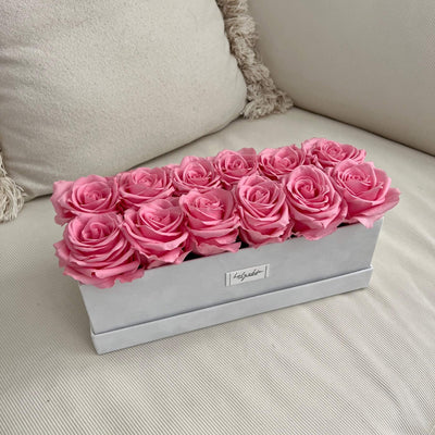 Forever roses set in a rectangular suede box