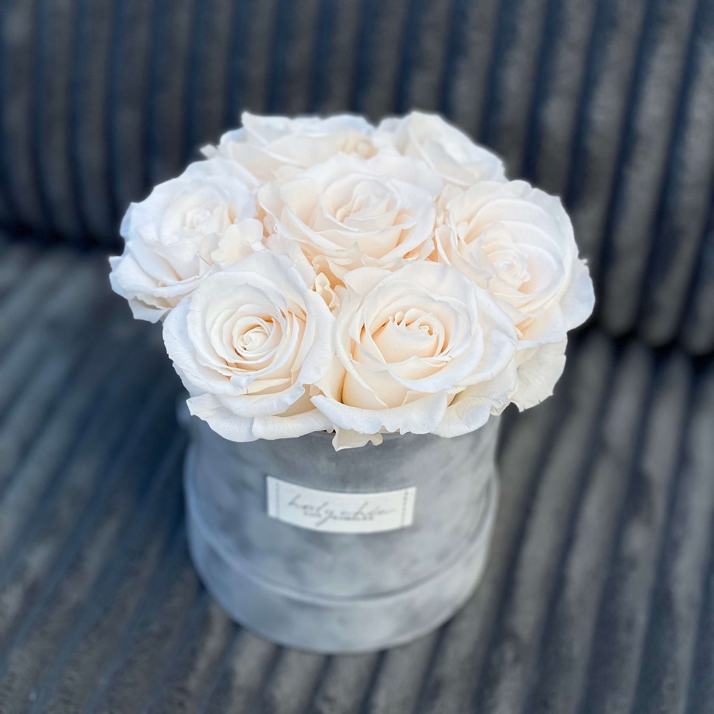 Forever roses in a small suede round box