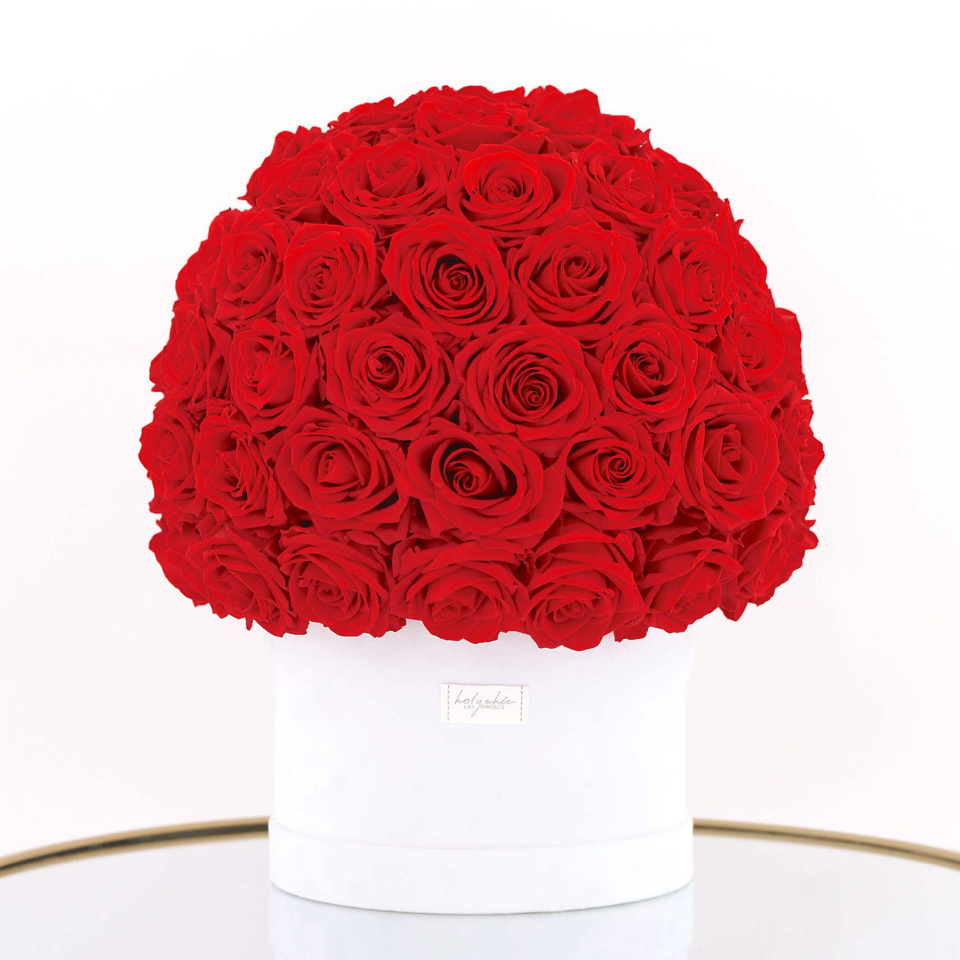 Forever roses set as a dome in a large round suede box 