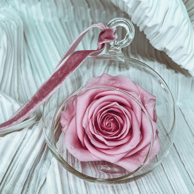 Forever rose in a round clear glass ornament