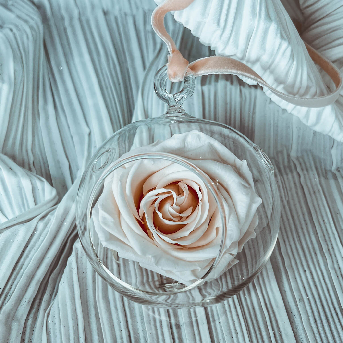 Forever rose in a round clear glass ornament