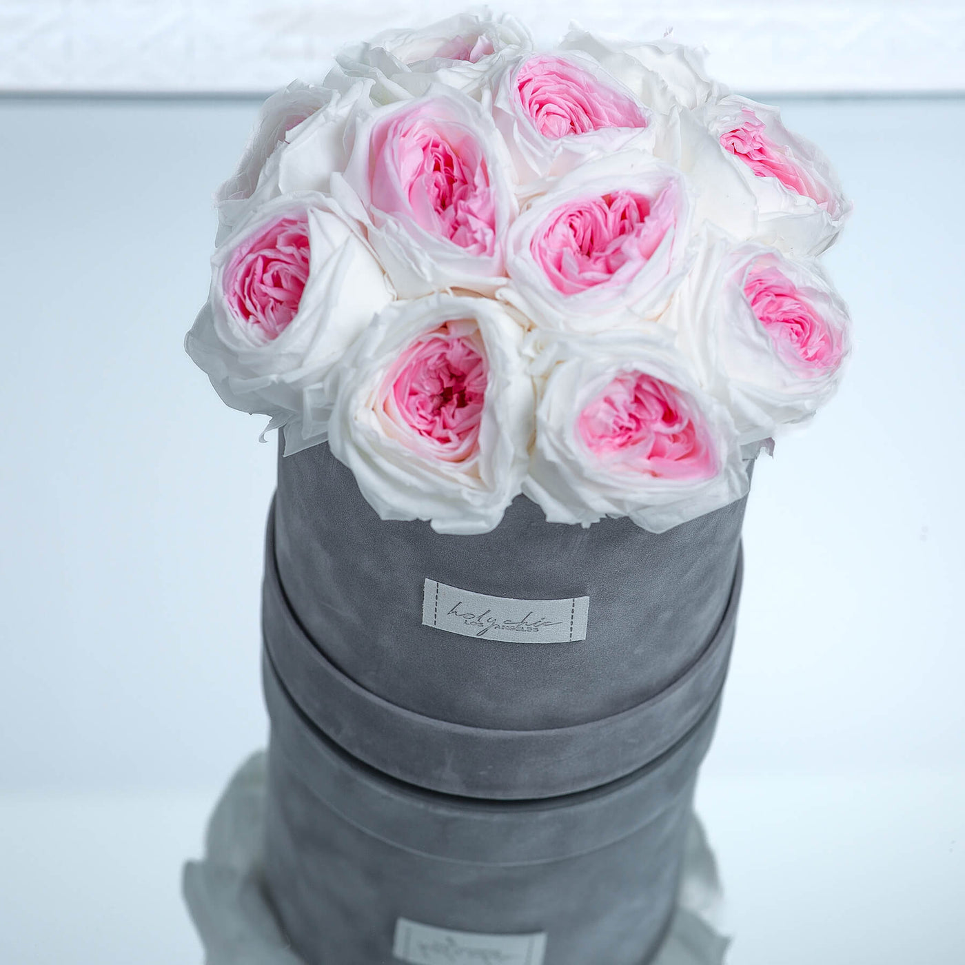 Forever roses set in a round suede box