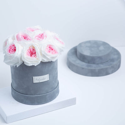 Forever roses set in a round suede box