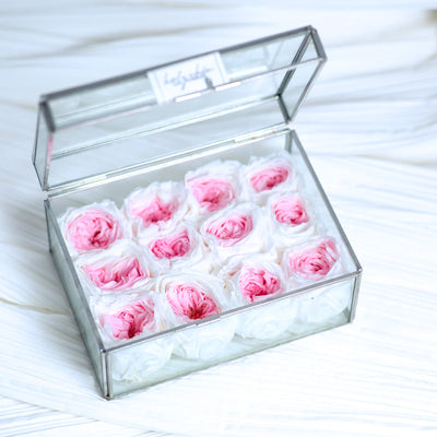 Forever roses in a clear glass jewelry box