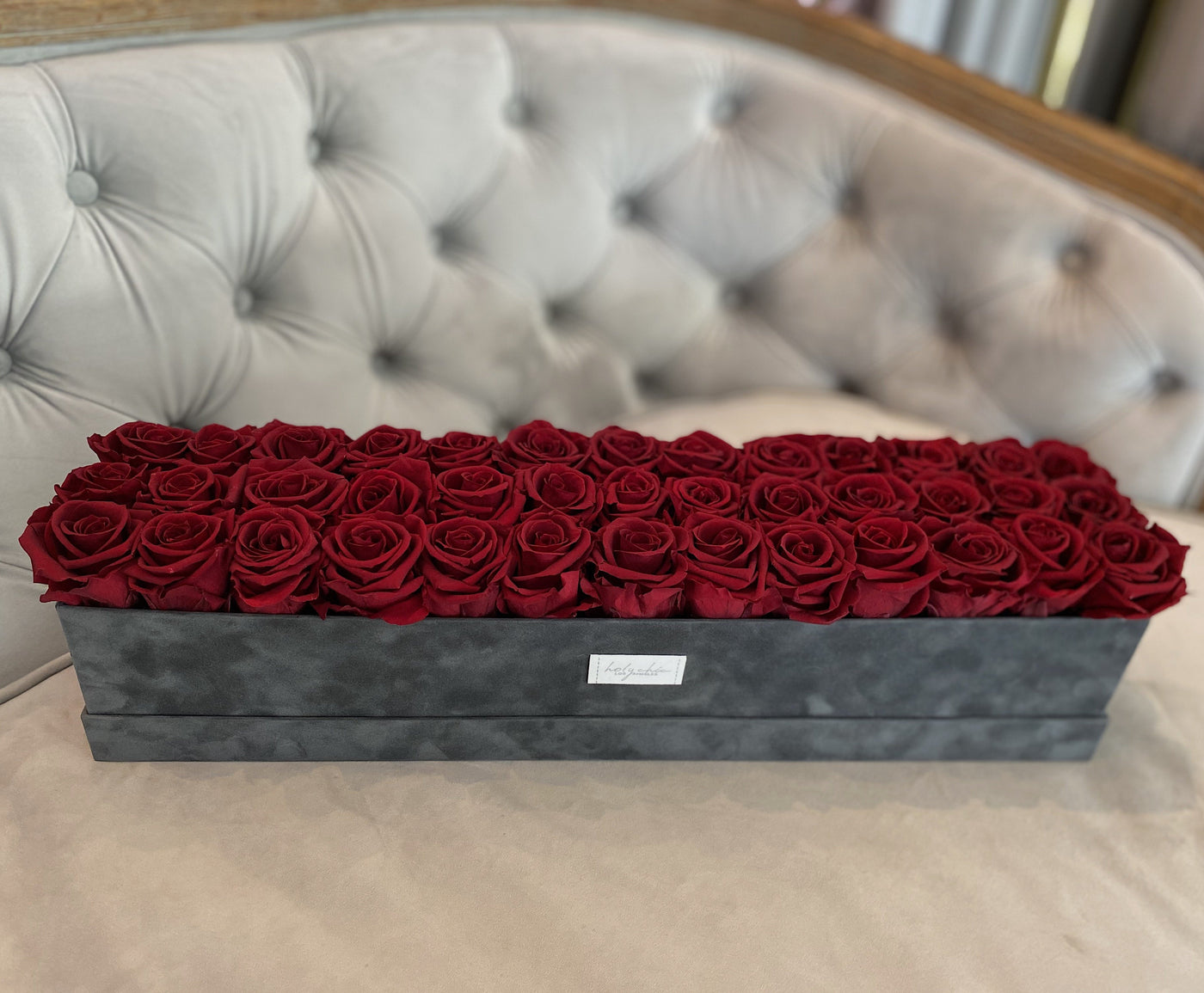 Forever roses set in a large rectangular suede box