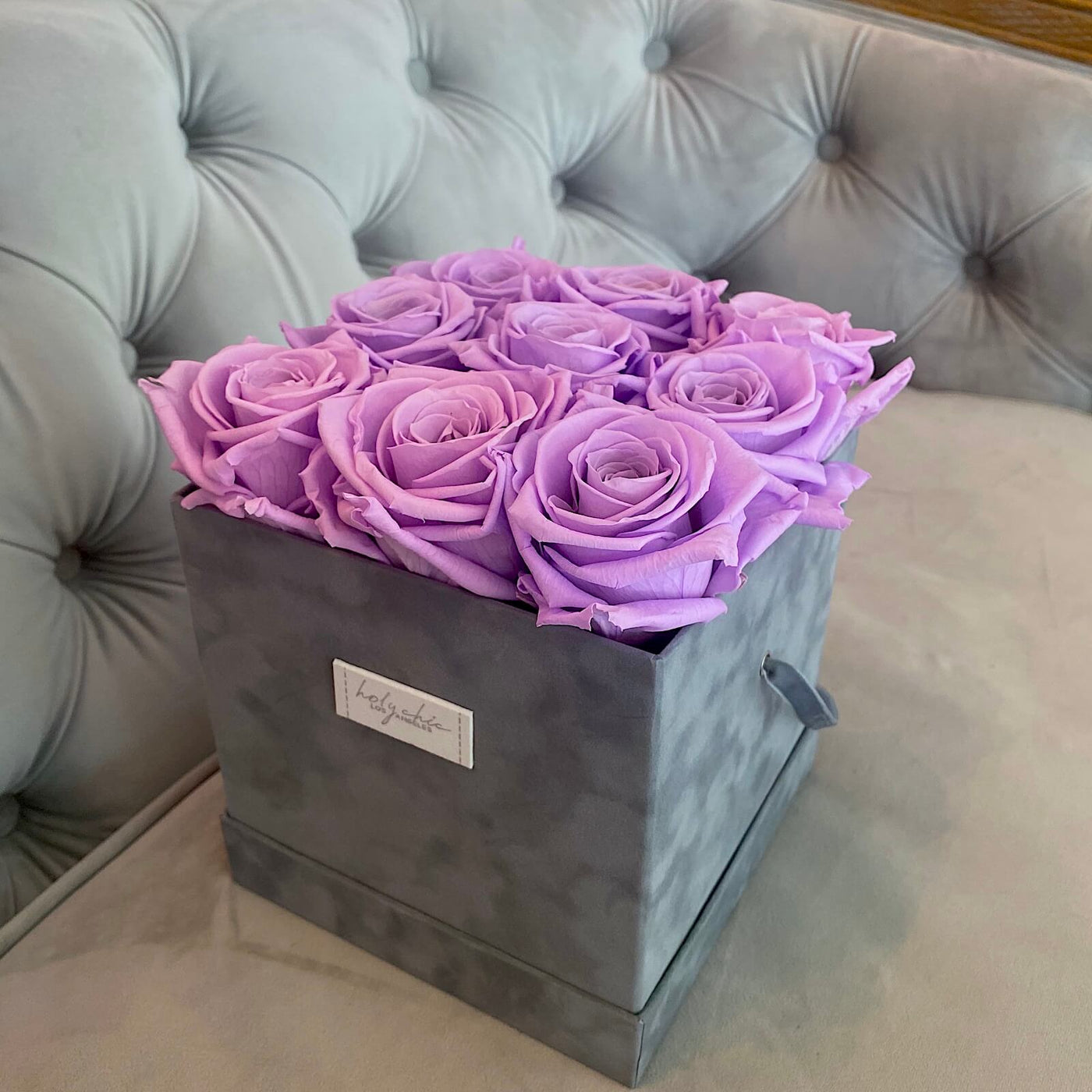 Forever roses set in a medium square suede box