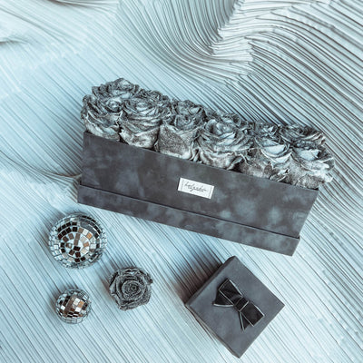 Sparkling forever roses set in a rectangular suede box
