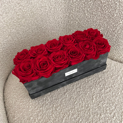 Forever roses set in a rectangular suede box