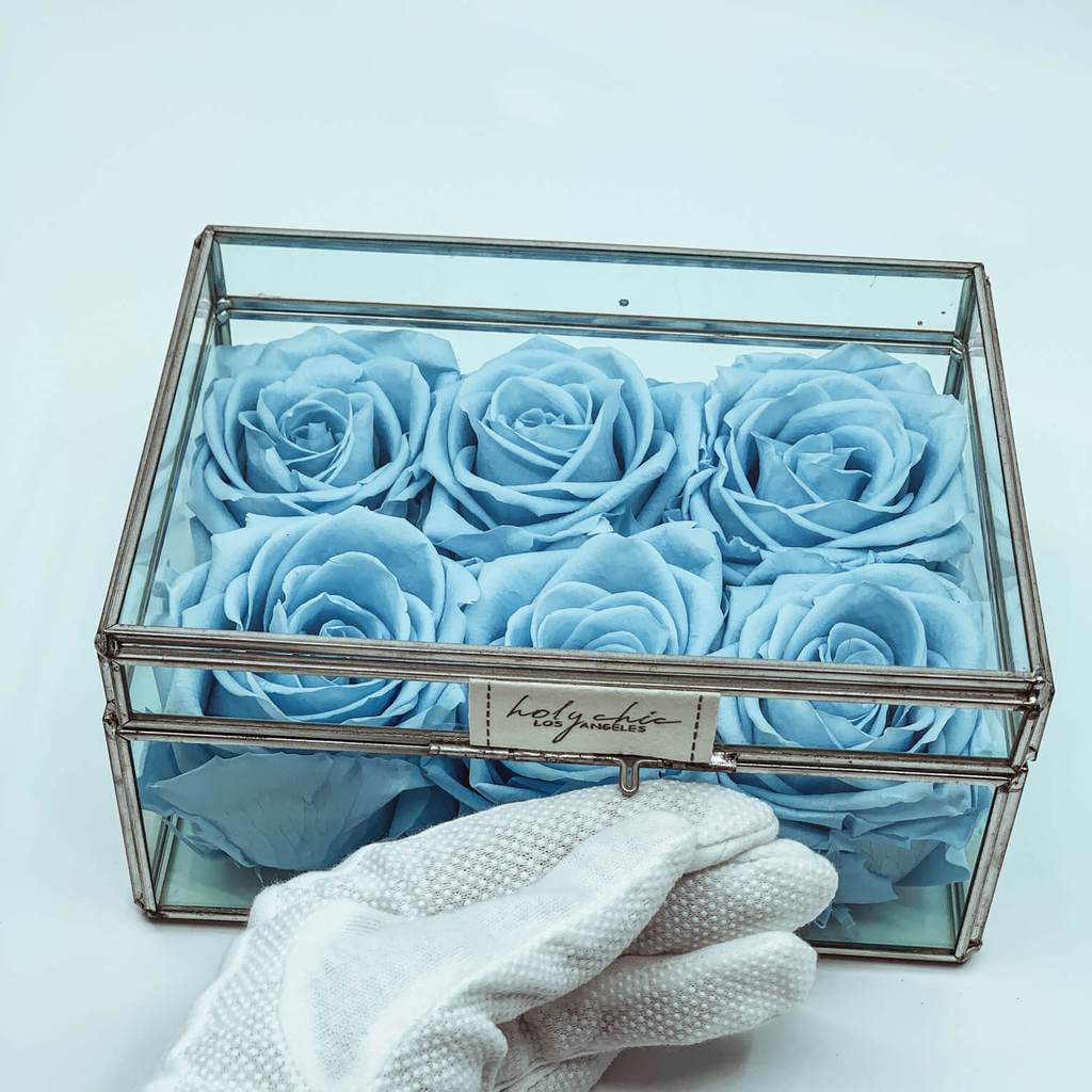 Forever roses in a small clear glass jewelry box