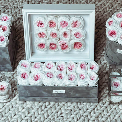 Forever roses set in a white square shadow box