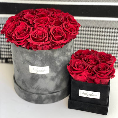 Forever roses set in a medium size round suede box