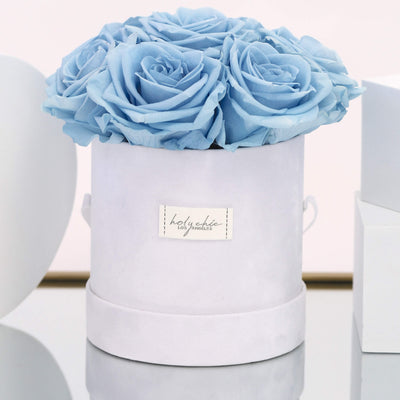Forever roses set in a round suede hat box