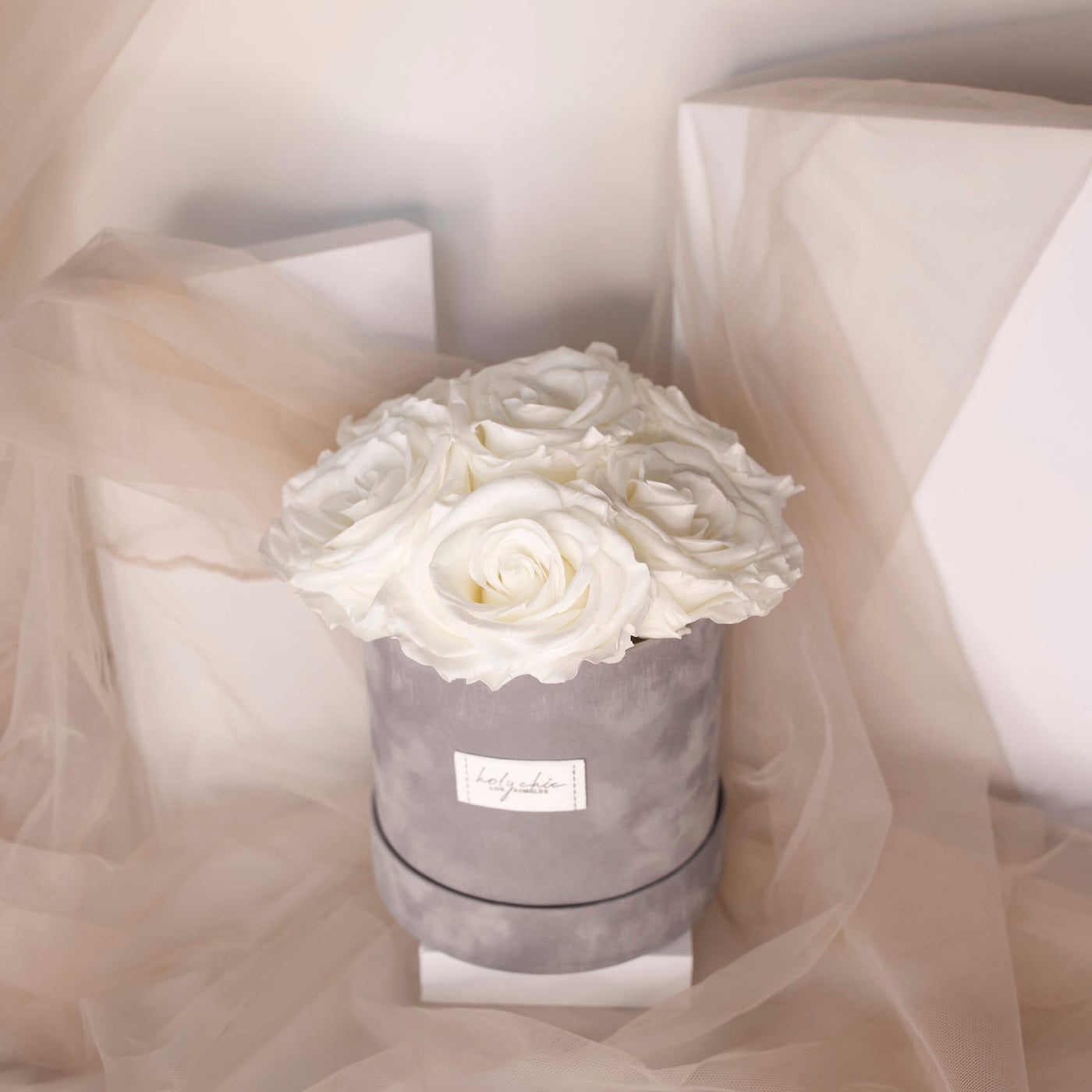 White forever roses in a light grey velvet box - Holy Chic Los Angeles