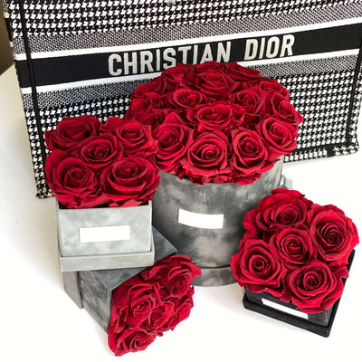 Forever roses set in a medium size round suede box