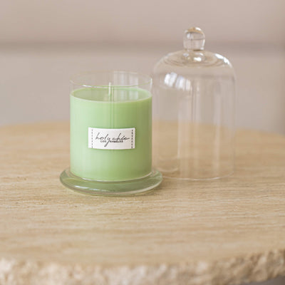Pale greeen mint scented candle in a glass cup with a cloche in medium size