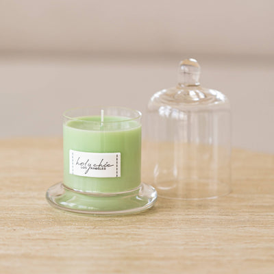 Pale greeen mint scented candle in a glass cup with a cloche in small size